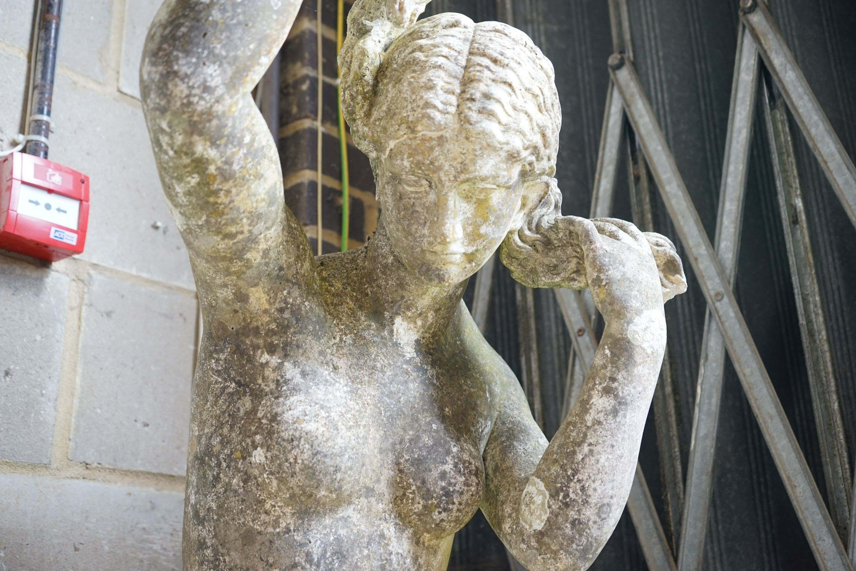 A weathered reconstituted stone garden statue of a robed female figure, height 155cm